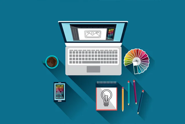 a laptop with coffee mug, mobile and pen copy on blue background