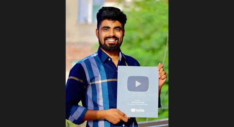 a man holding youtube silver play button