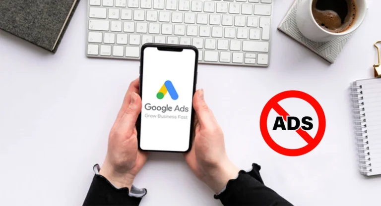 a man holding phone that have google ads icon in screen