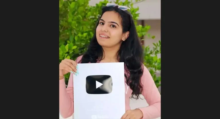 a girl holding youtube silver play button